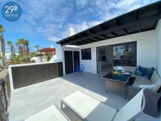 Spacious south facing patio with enclosed pergola
